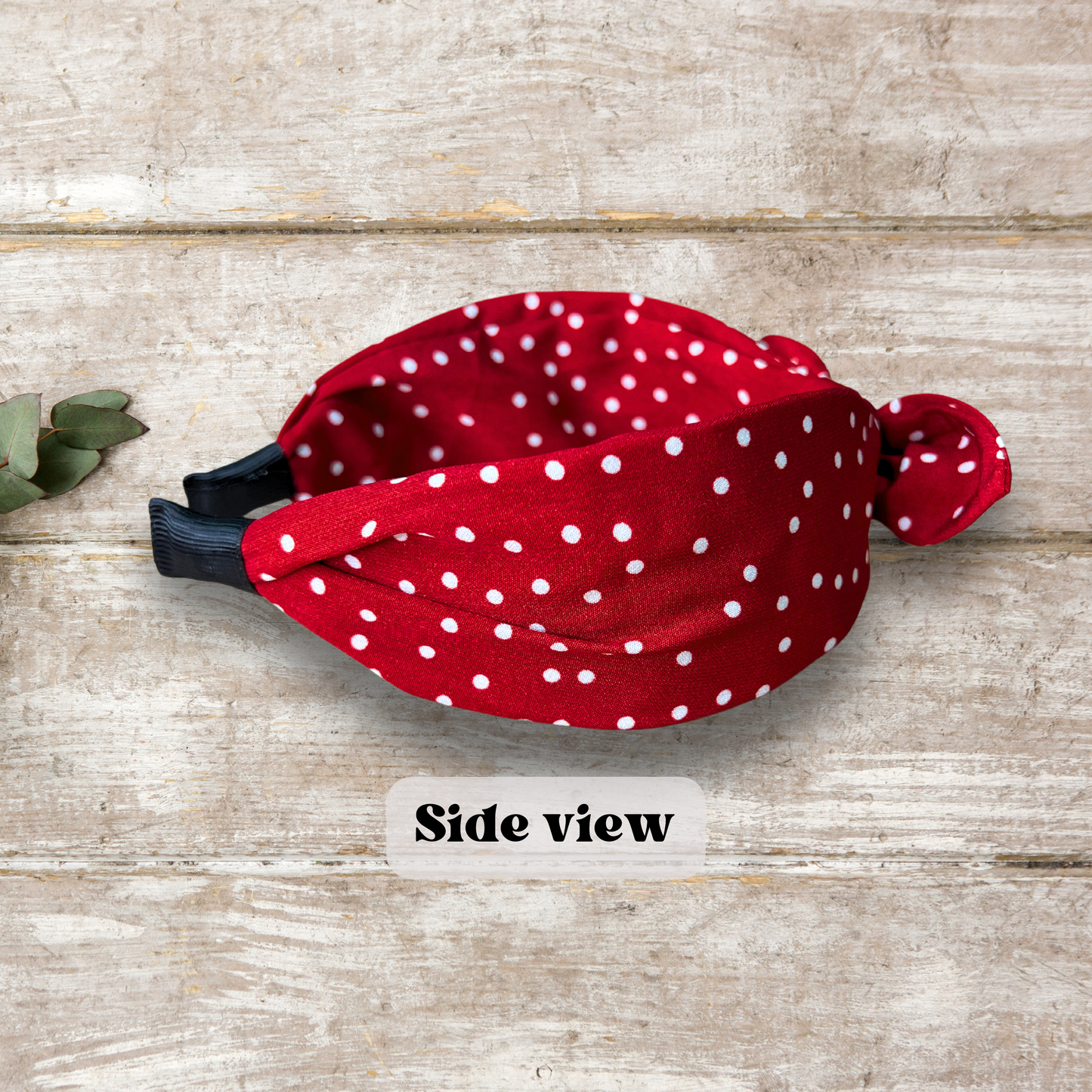 Side view of Red colored Retro rabbit ear headband with twist knot design in vintage colors, perfect for a stylish and classic look