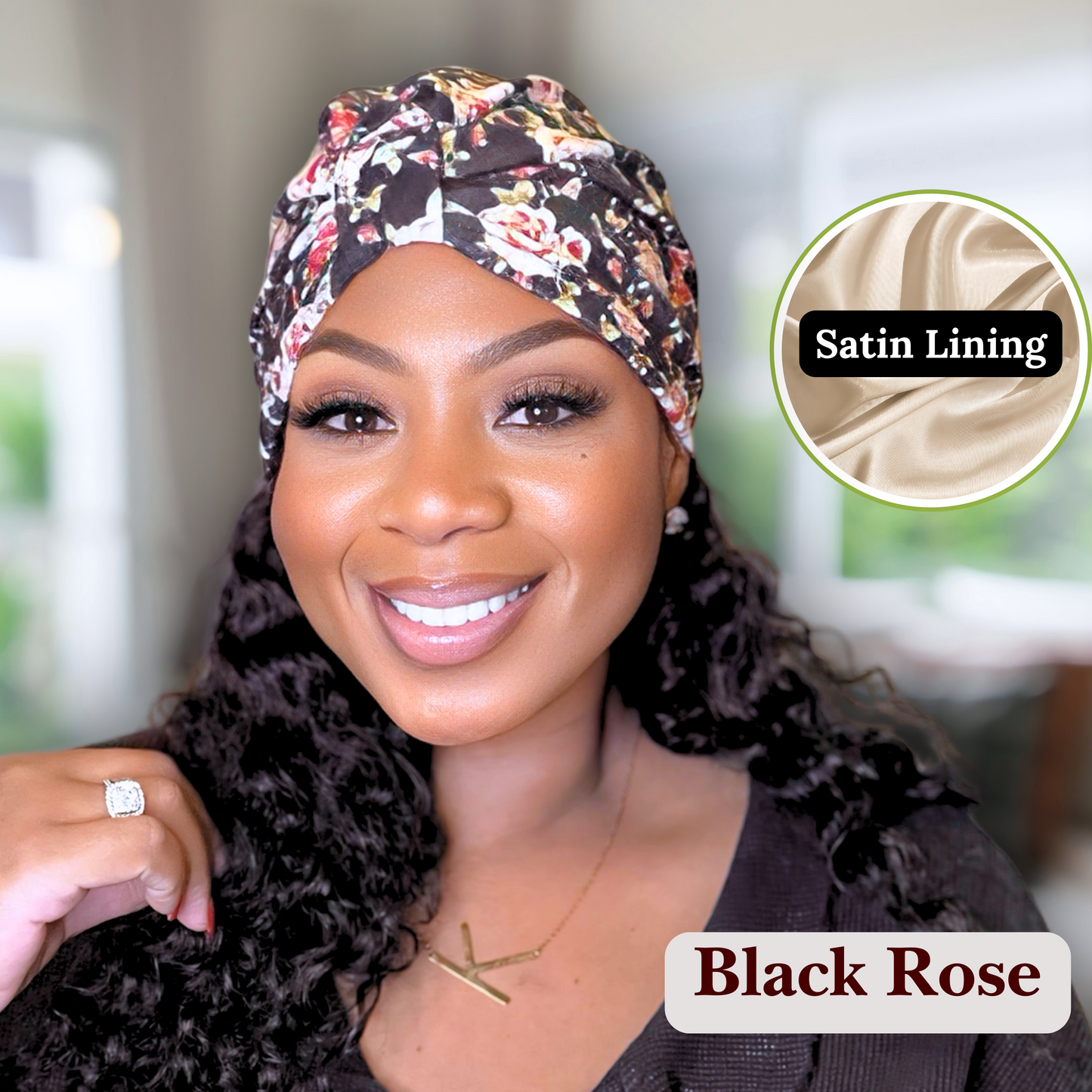 Black Rose satin lined turban modeled on an African American Model with long wavy hair in a blurred living room.