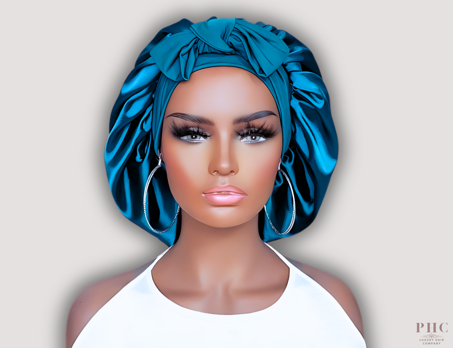 mannequin doll modeling a peacock blue stretch tie satin bonnet