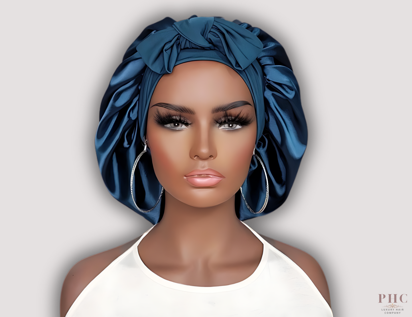 Beautiful African-American mannequin wearing a midnight blue satin hair bonnet on a gray background.