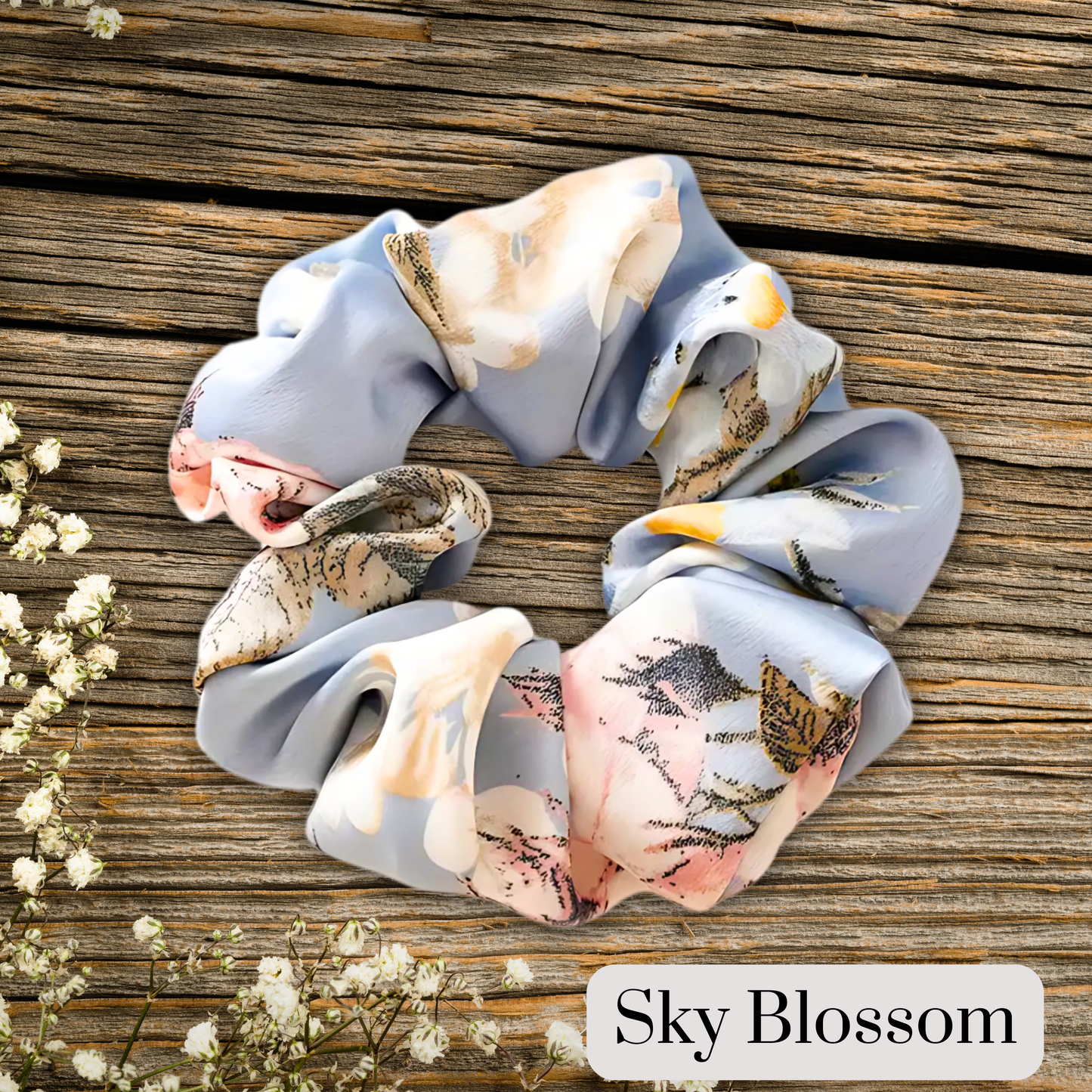 Baby Blue floral satin scrunch on a wooden plank background. Sky Blossom.