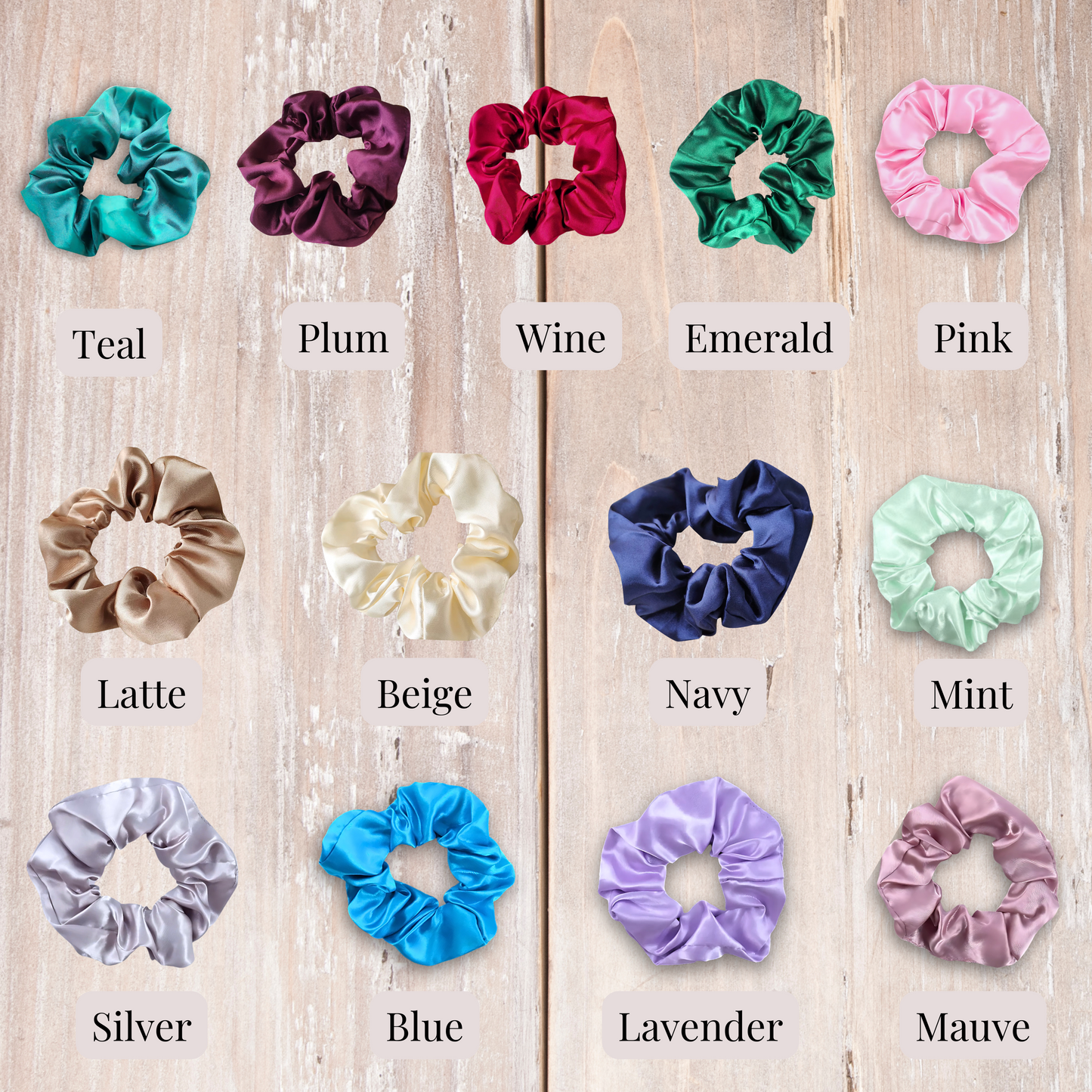 Satin scrunchies on wood background in the colors teal, plum, wine, emerald, pink, latte, beige, navy, mint, silver, blue, lavender and mauve