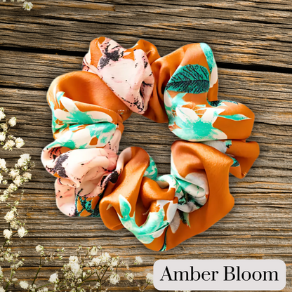 Amber floral satin scrunch on a wooden plank background. Amber Bloom