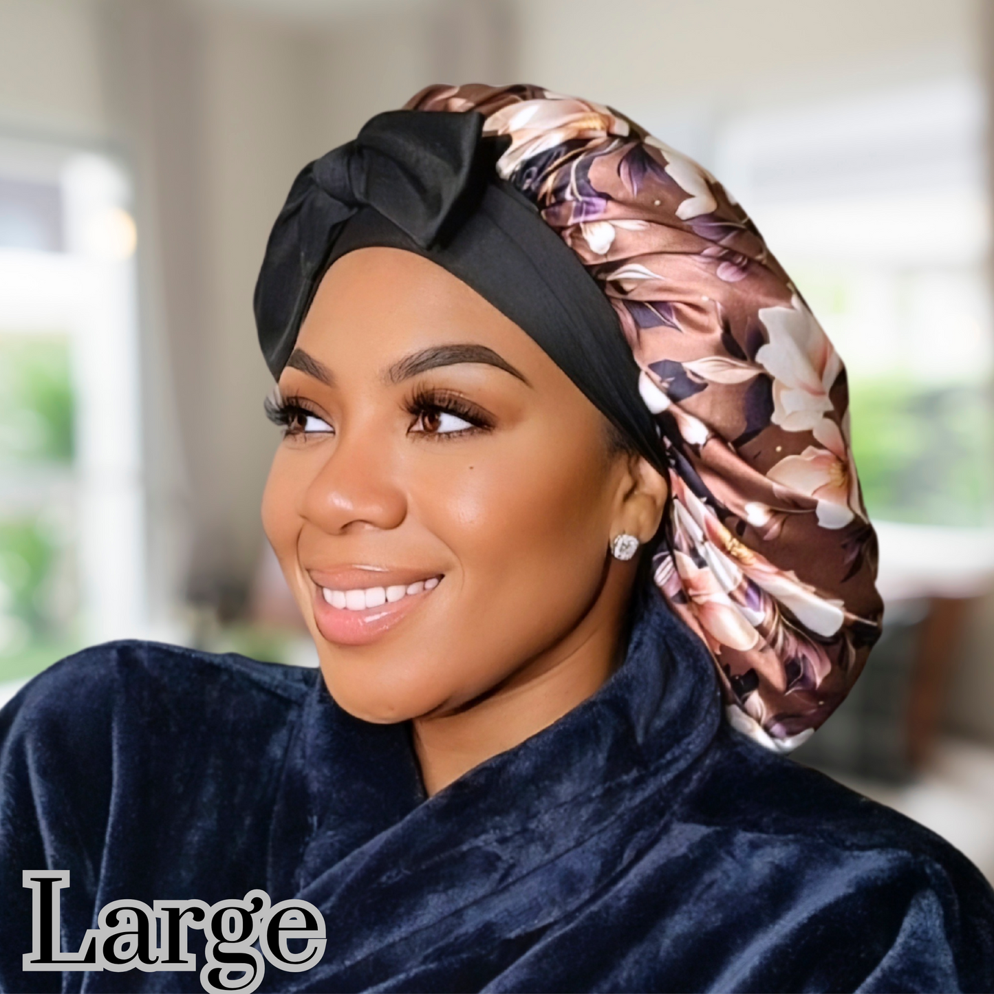 Beautiful brown magnolia flower bonnet with a silky satin gold lining with long black stretch ties being worn by an African American model.