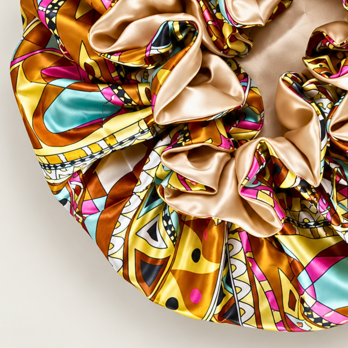 Close-up of the Champagne Ankara ruffle satin bonnet with champagne satin ruffles