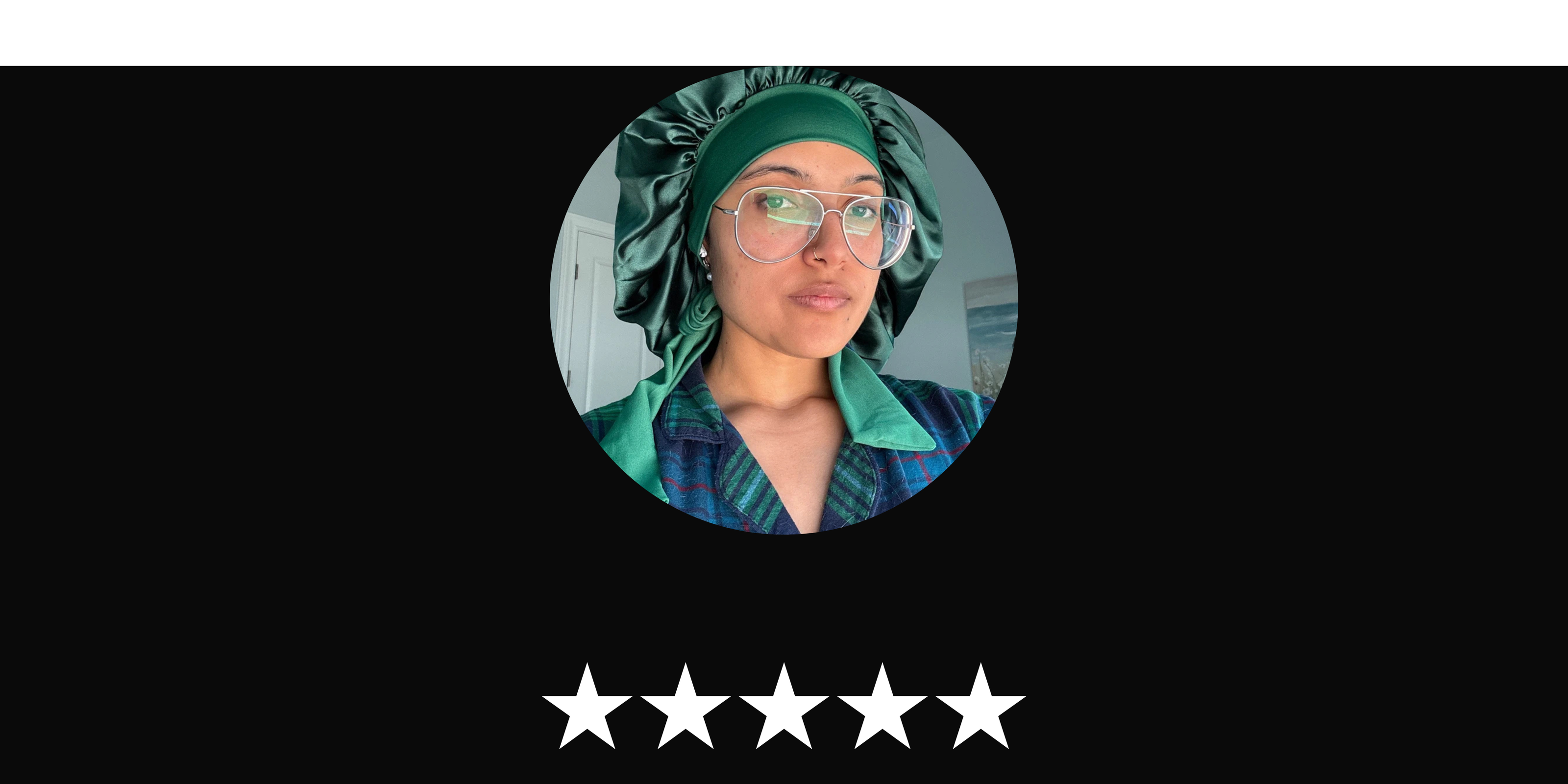 Person wearing a Luxury Hunter Green bonnet with glasses under a five-star rating.
