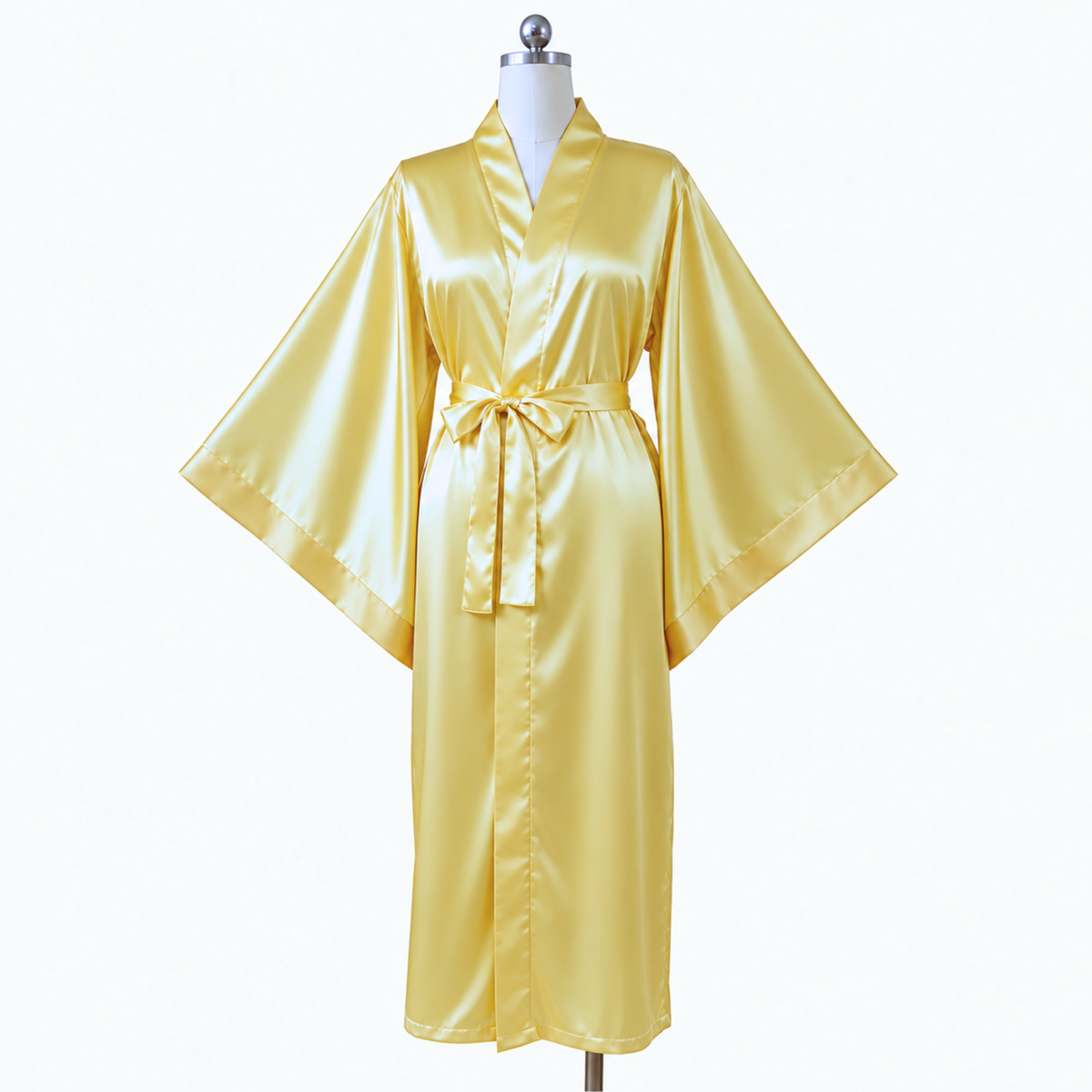 A shiny yellow gold kimono-style robe displayed on a white mannequin torso against a plain white background.