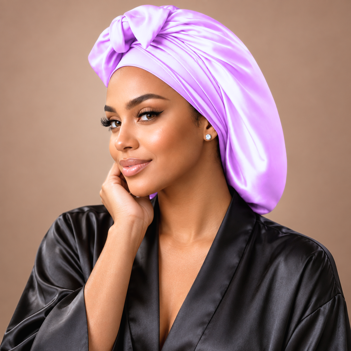 Lilac satin bonnet and matching band shown in a studio portrait