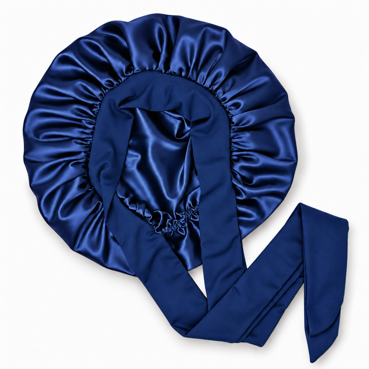 A navy blue satin bonnet with long ties, arranged on a clean white background.