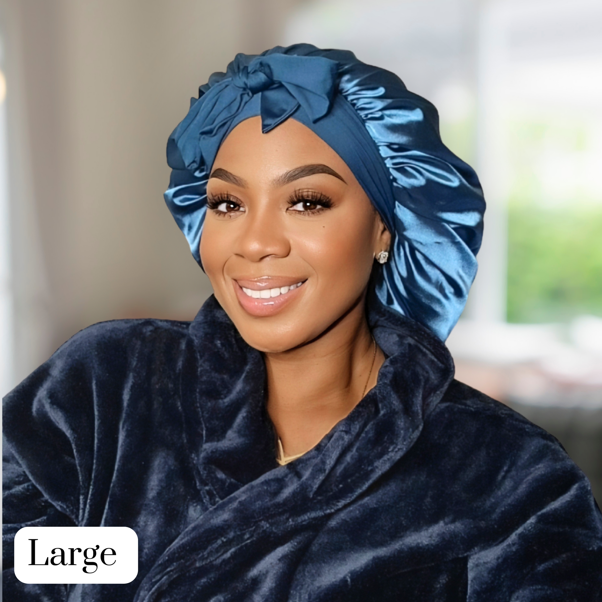 Model wearing a Peacock blue Stretch Tie satin hair bonnet tied in a bow. The bonnet is showcasing a smooth satin texture and vibrant color. Ideal for curly, natural, and protective hairstyles.