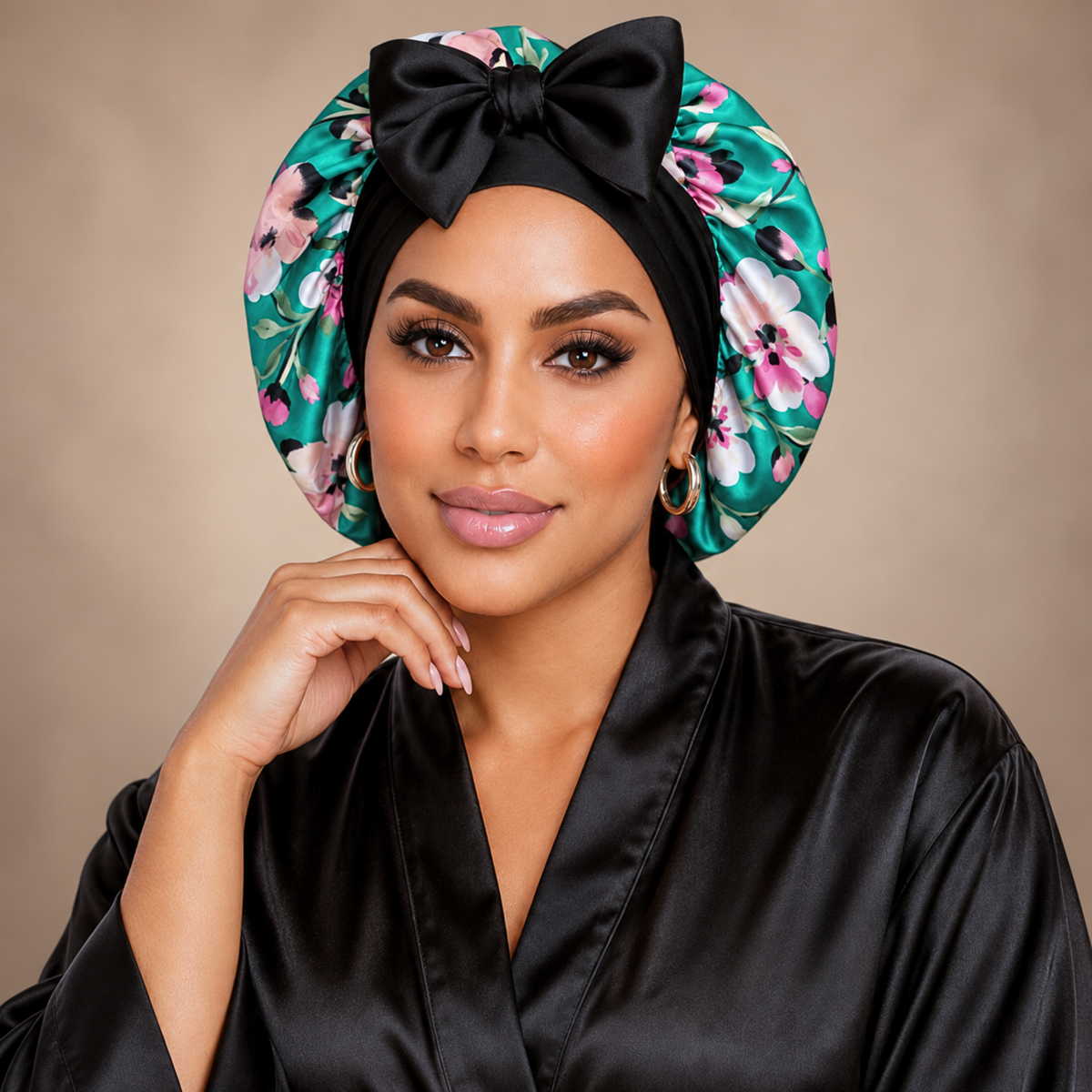 Teal Flowers silk-blend satin bonnet with stretch ties, small size – front view with black bow, worn with a black satin robe