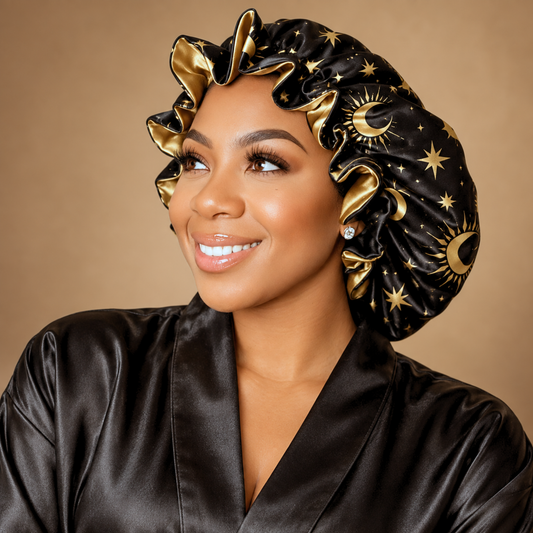 Woman wearing the Starry Night ruffle satin bonnet, black satin with gold moons and stars