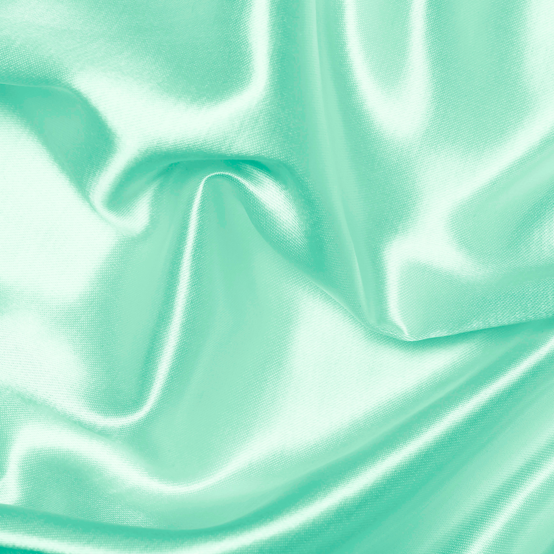 Close-up of teal satin fabric with folds