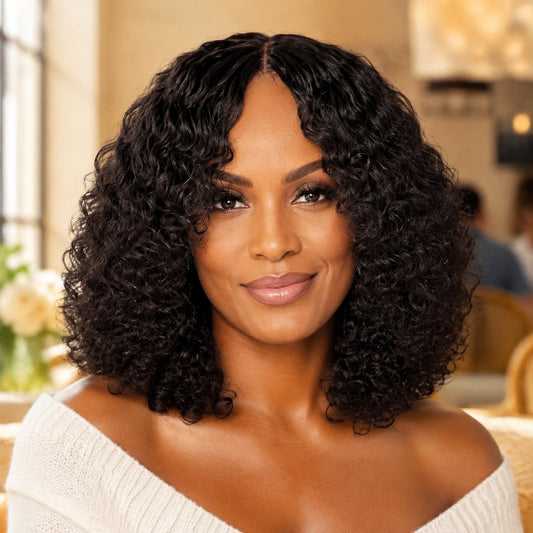 Black woman wearing Barbara glueless curly human hair wig with bangs