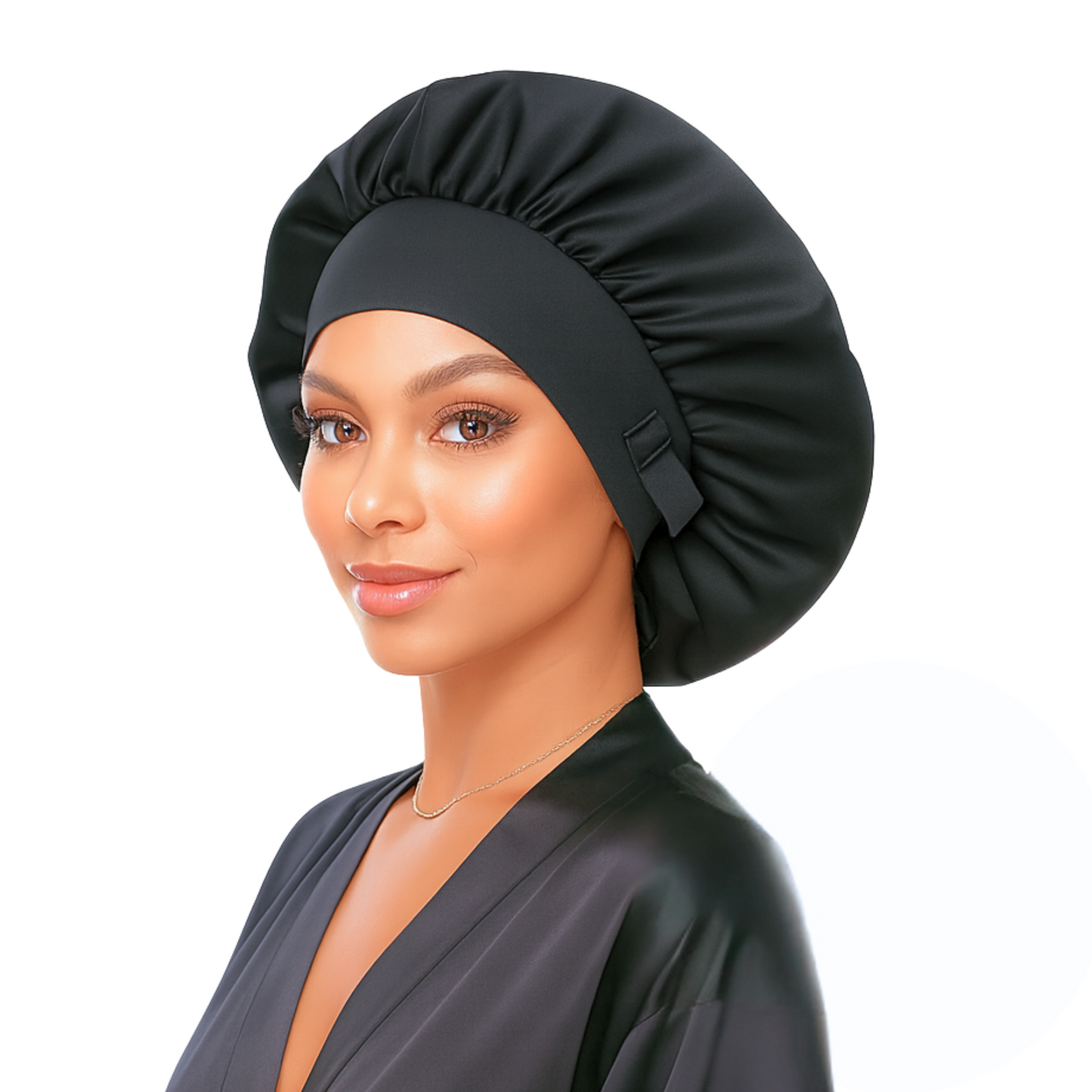 Woman wearing a black satin hair bonnet on a white background