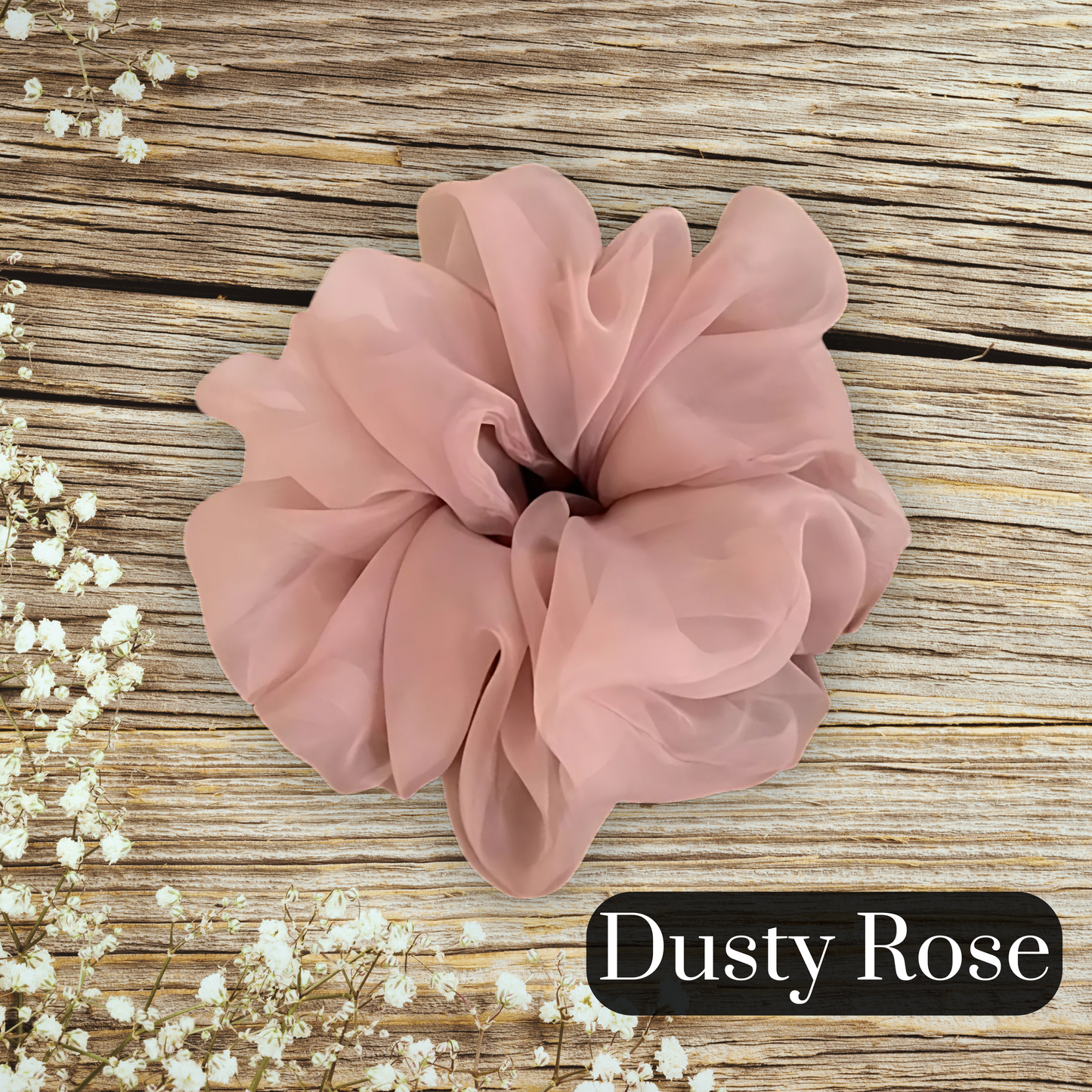 chiffon scrunchie in blush on a large wood table measuring 16 cm in diameter