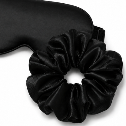 Close-up of satin eye mask and oversized scrunchie sleep set