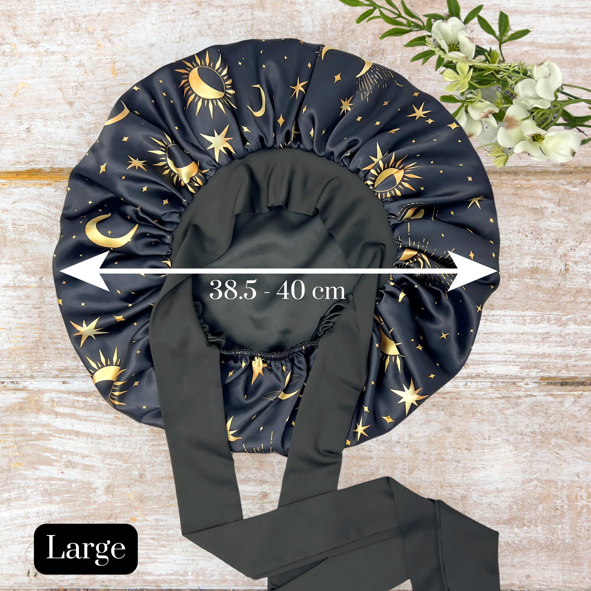 Satin Lined Bonnet in Custom PHC Starry Print with adjustable stretch ties. Perfect silky satin sleep cap for protecting your hair throughout the night.