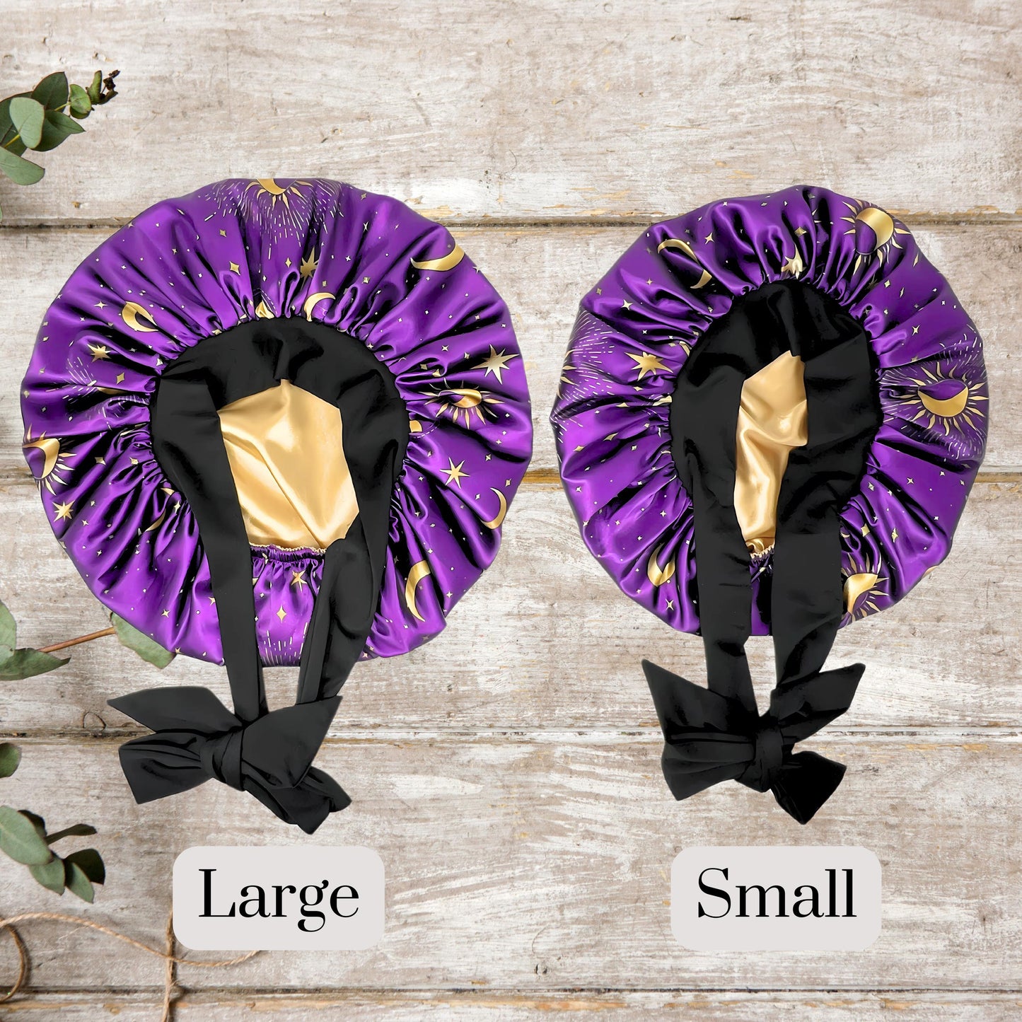 Interior view of the Celestial Plum bonnet highlighting the two different size of bonnet offerings, gold satin lining and black stretch tie.