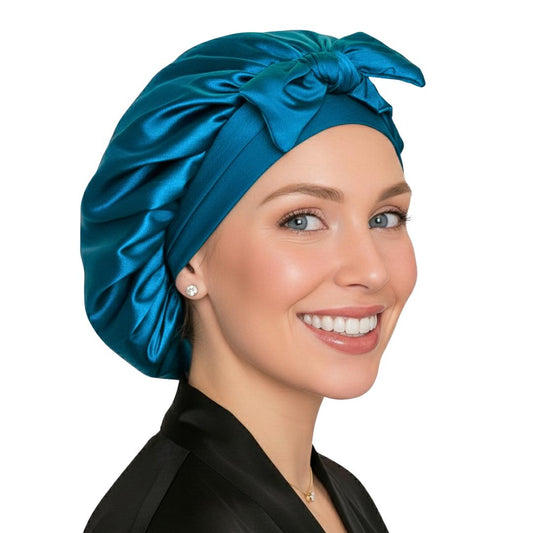 Small peacock teal satin sleep cap with adjustable tie band for short natural hair styles.