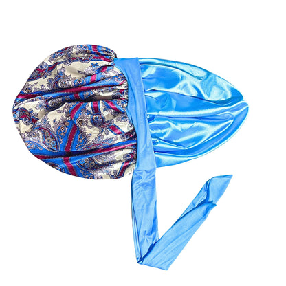 Paisley damask satin stretch-tie bonnet with light blue lining and long adjustable ties photographed flat against a white background.