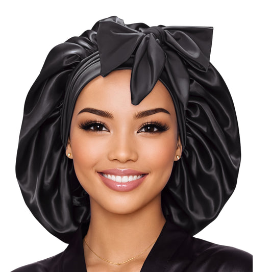 Large black satin bonnet with adjustable stretch tie band for protecting natural hair and long braids while sleeping.