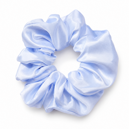 Oversized baby blue satin scrunchie on a clean white background