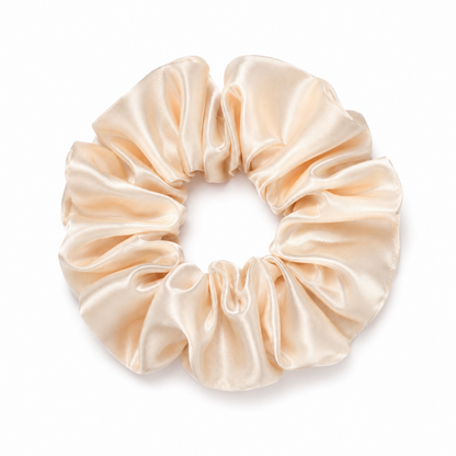 Oversized champagne satin scrunchie on a clean white background