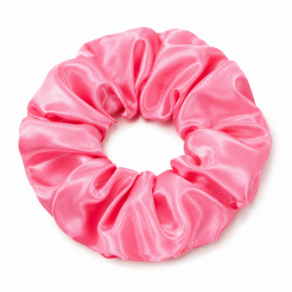 Oversized punch pink satin scrunchie on a clean white background