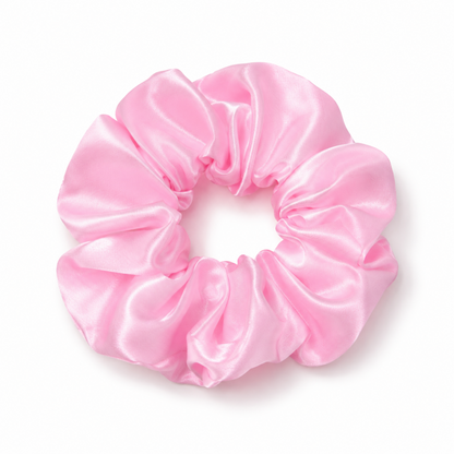 Oversized soft pink satin scrunchie on a clean white background