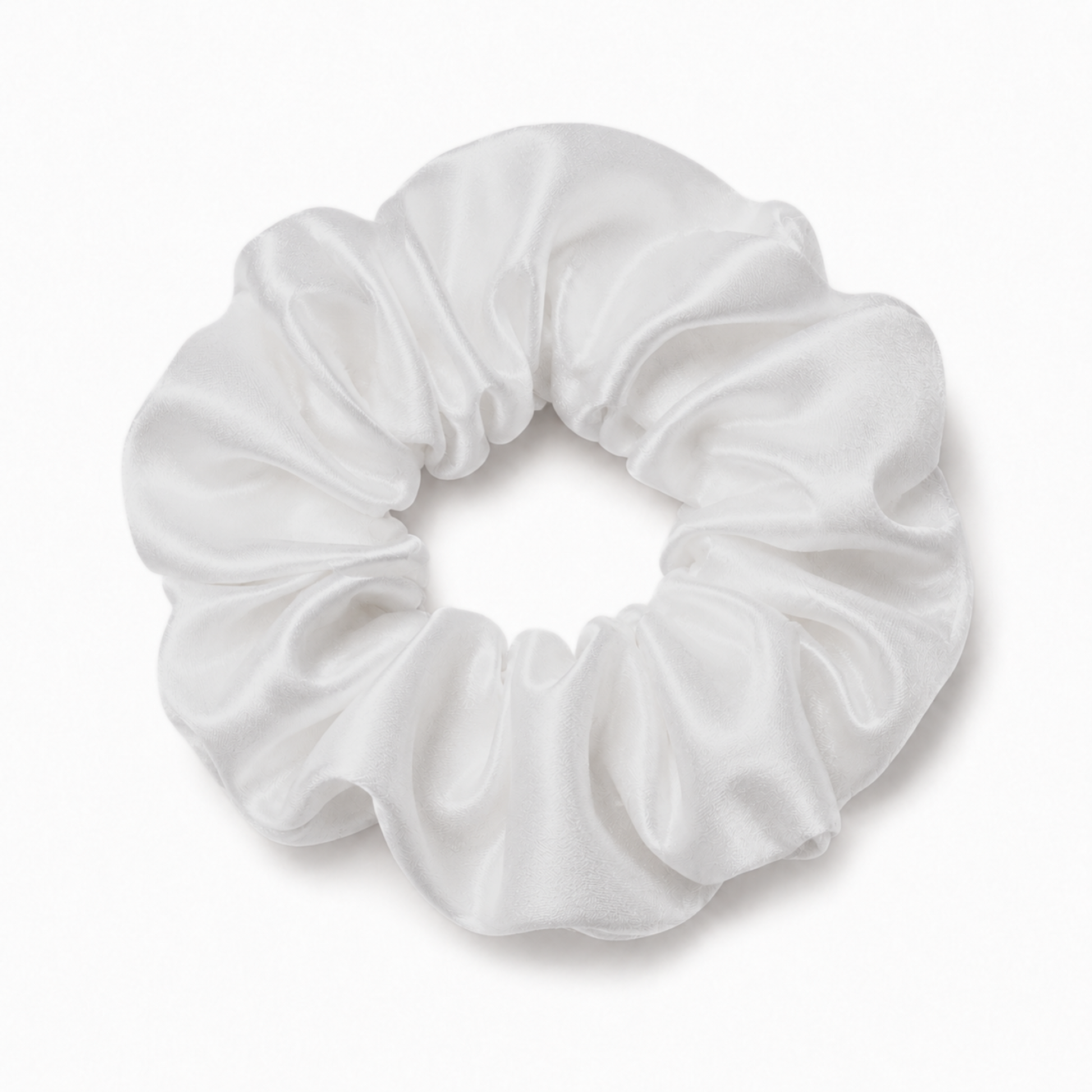 Oversized white satin scrunchie on a clean white background