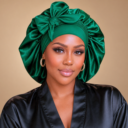 Front view of a hunter green satin bonnet with a large matching bow
