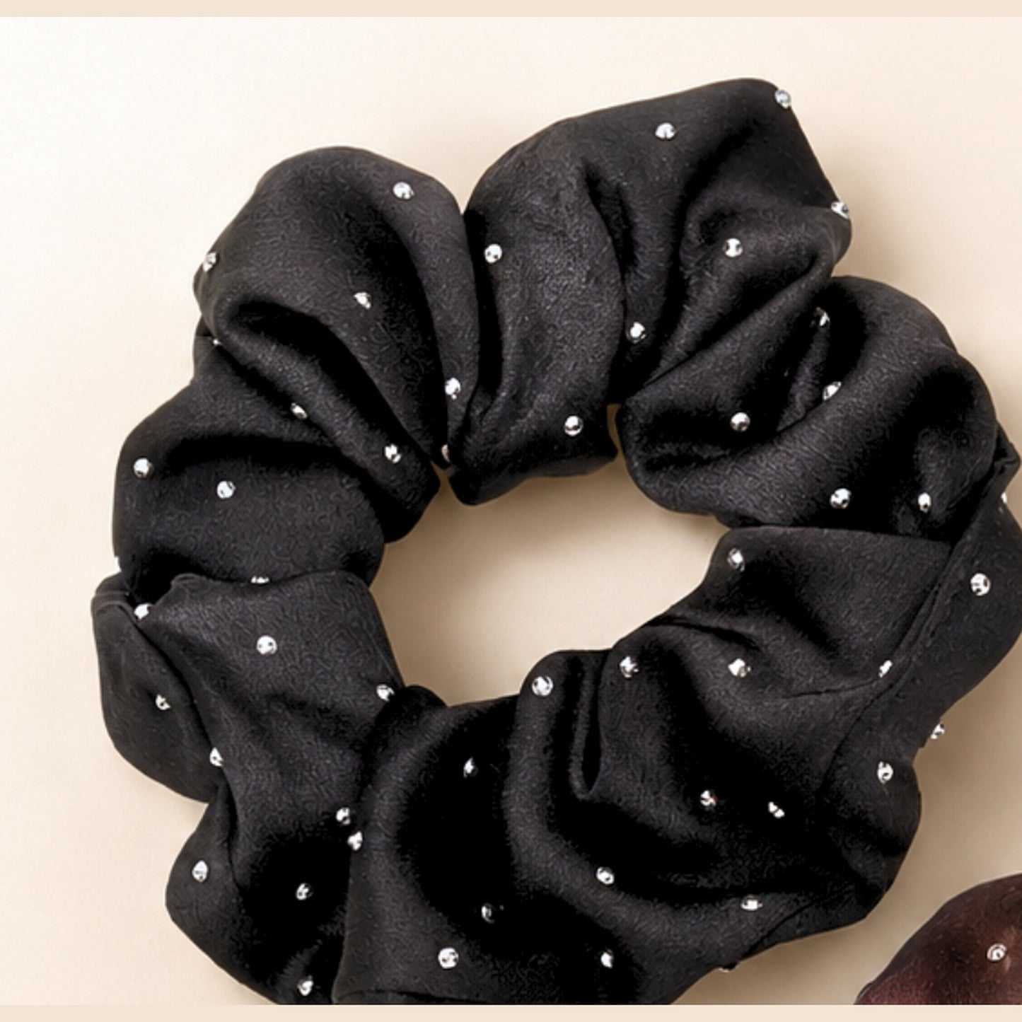 Black rhinestone satin scrunchie close-up with mini rhinestone details