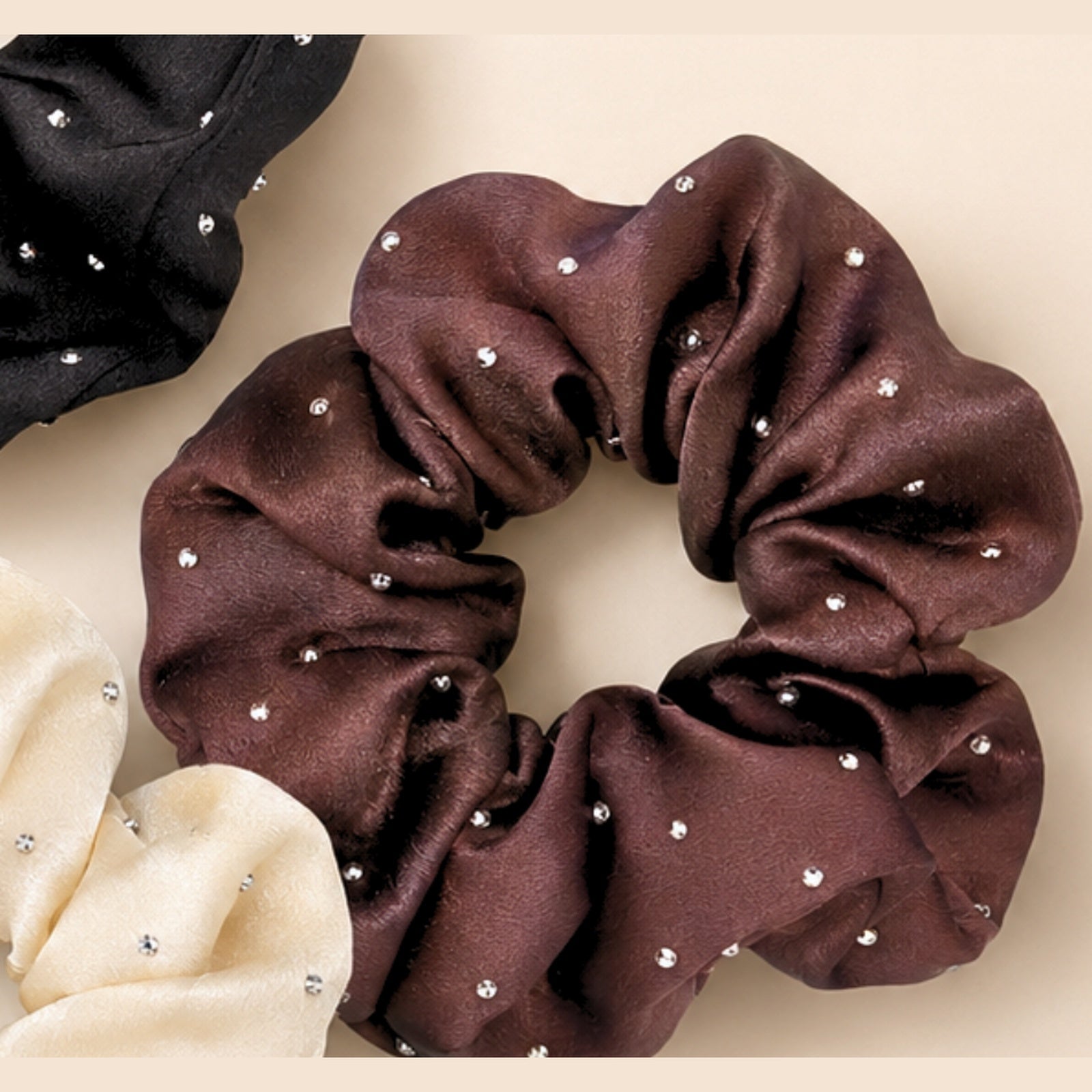 Mocha brown rhinestone satin scrunchie close-up showing satin texture