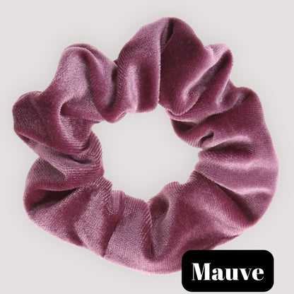 A single Mauve dusty pink handmade velvet scrunchie for damage-free hair styling on a light background, featuring a black label reading 'Mauve'.