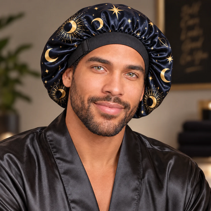 Close-up of a man wearing the Starry Night satin bonnet with gold moons, suns and stars and a black sliding adjuster.