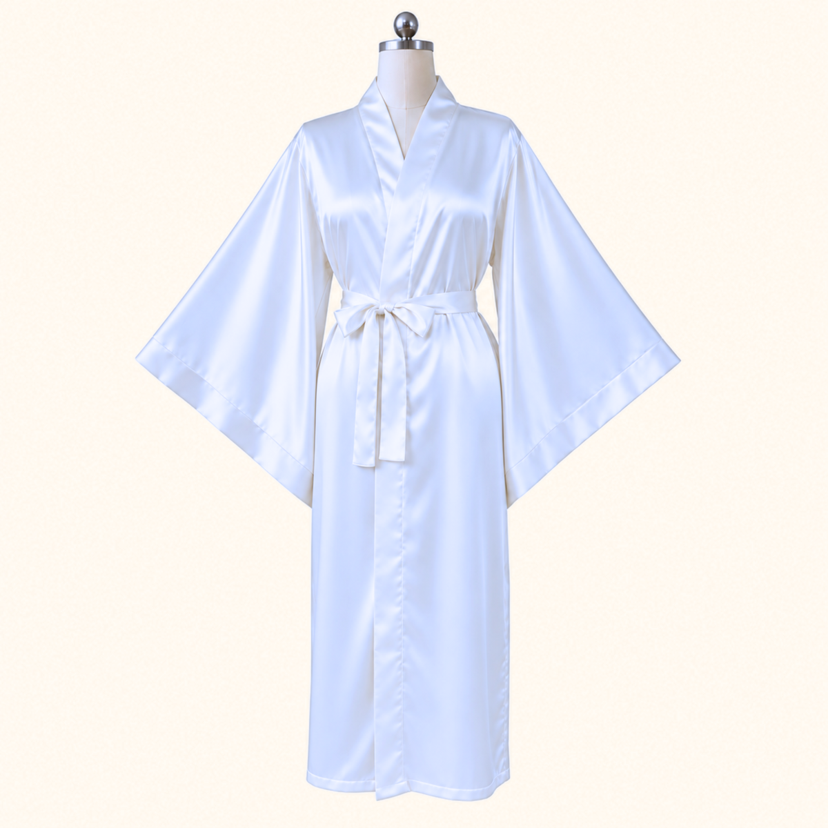 A white satin kimono robe displayed on a mannequin torso against a plain light beige background.