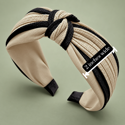 Beige and black twisted knot headband with an annotated arrow showing the band is 2 inches wide.