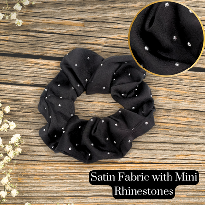 detailed image of a satin fabric rhinestone scrunchie in the color black