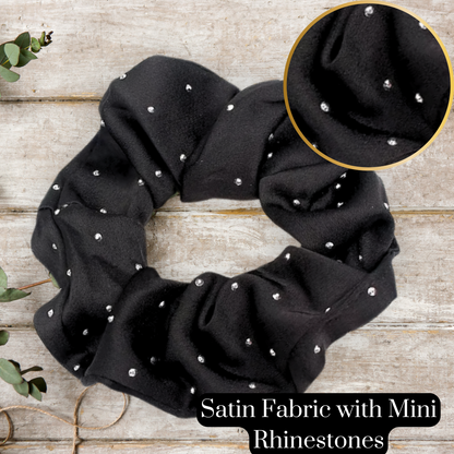 sparkling black hair scrunchie on a wooden table
