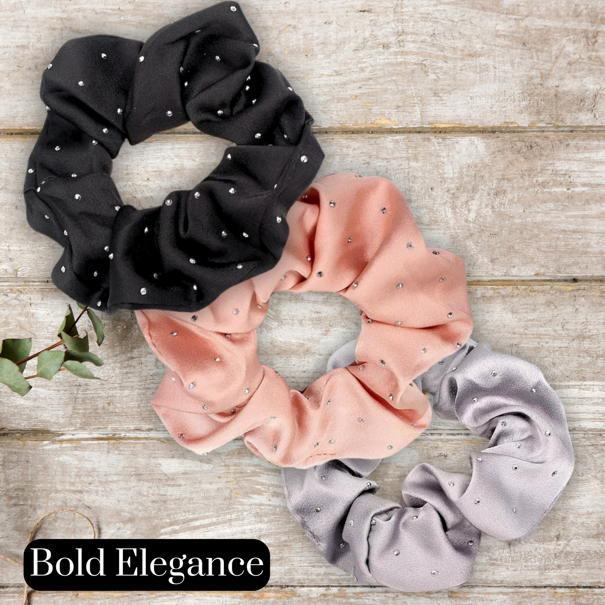main image of black, rose gold and silver satin rhinestone scrunchies on a wood background