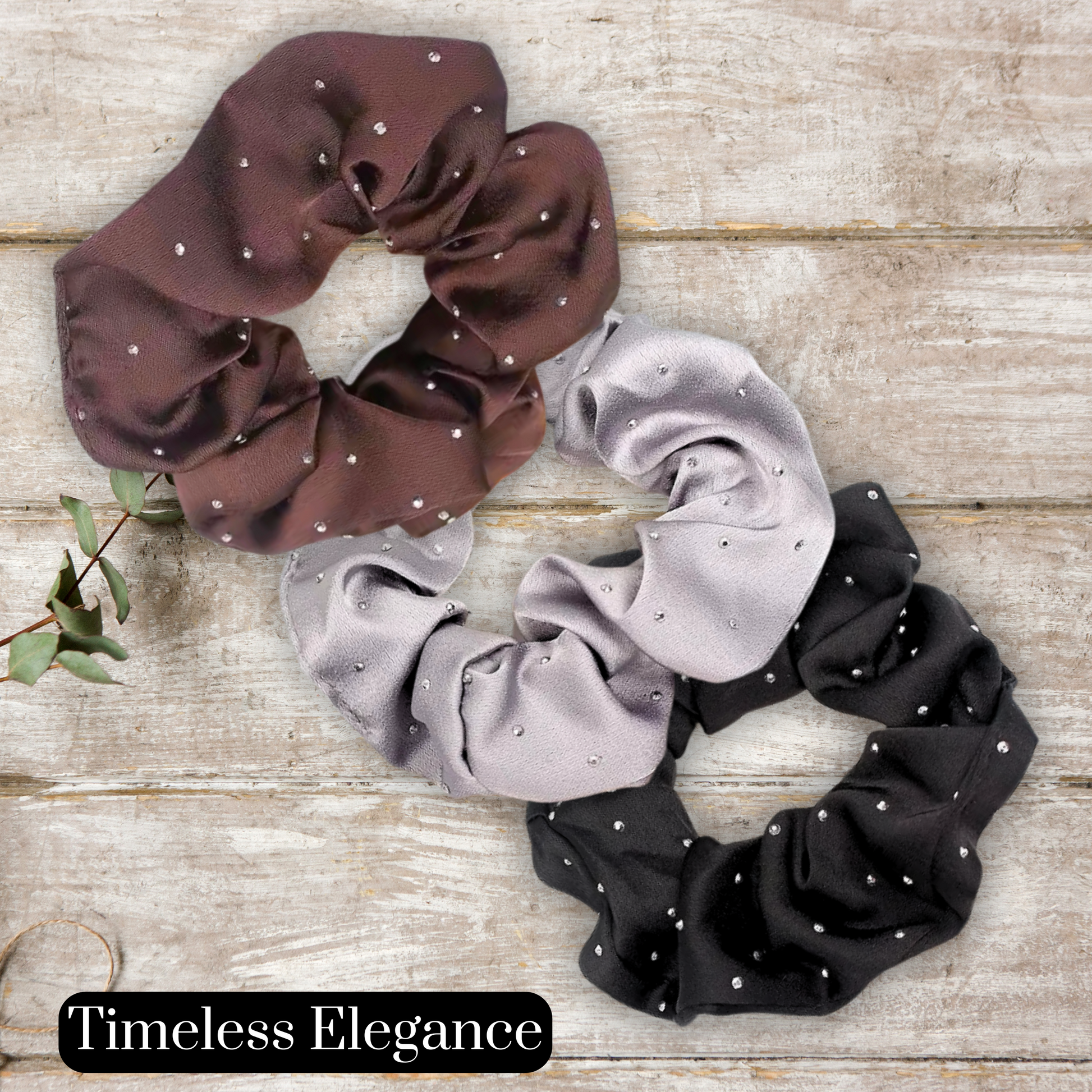 main image of black, Mocha and silver satin rhinestone scrunchies on a wood background