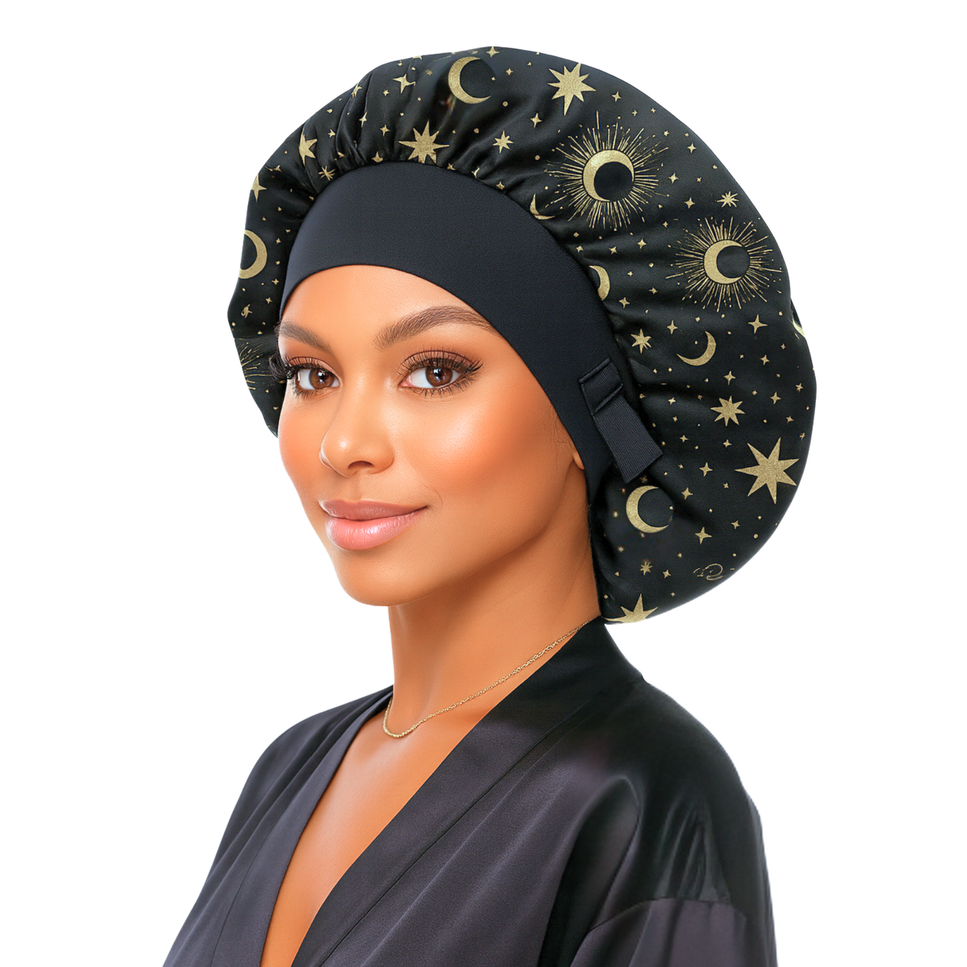 Woman wearing a black satin head wrap with gold celestial patterns on a white background