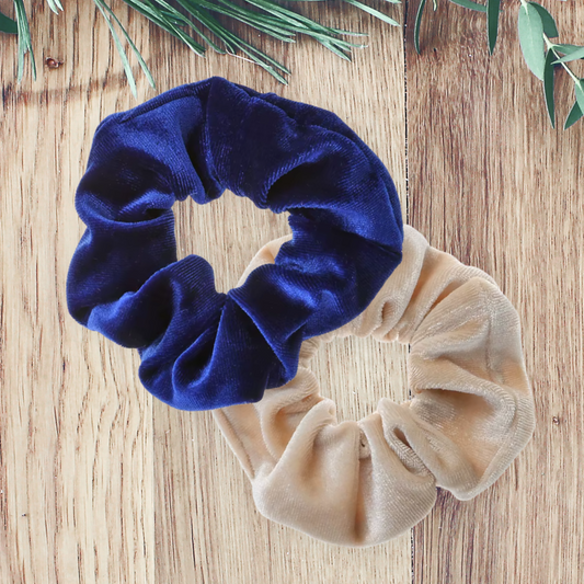 Royal blue and Beige Velvet Scrunchie on a wooden background.