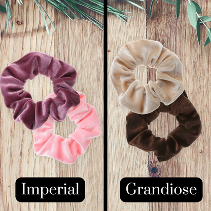 Mauve, pink, beige and brown velvet scrunchies on a wooden background.