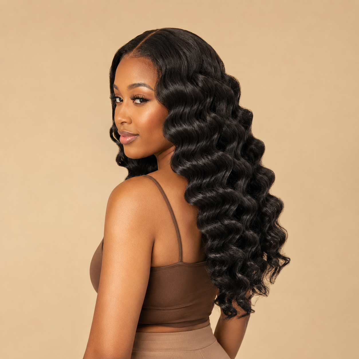 Model wearing natural black virgin Brazilian loose deep wave human hair bundles